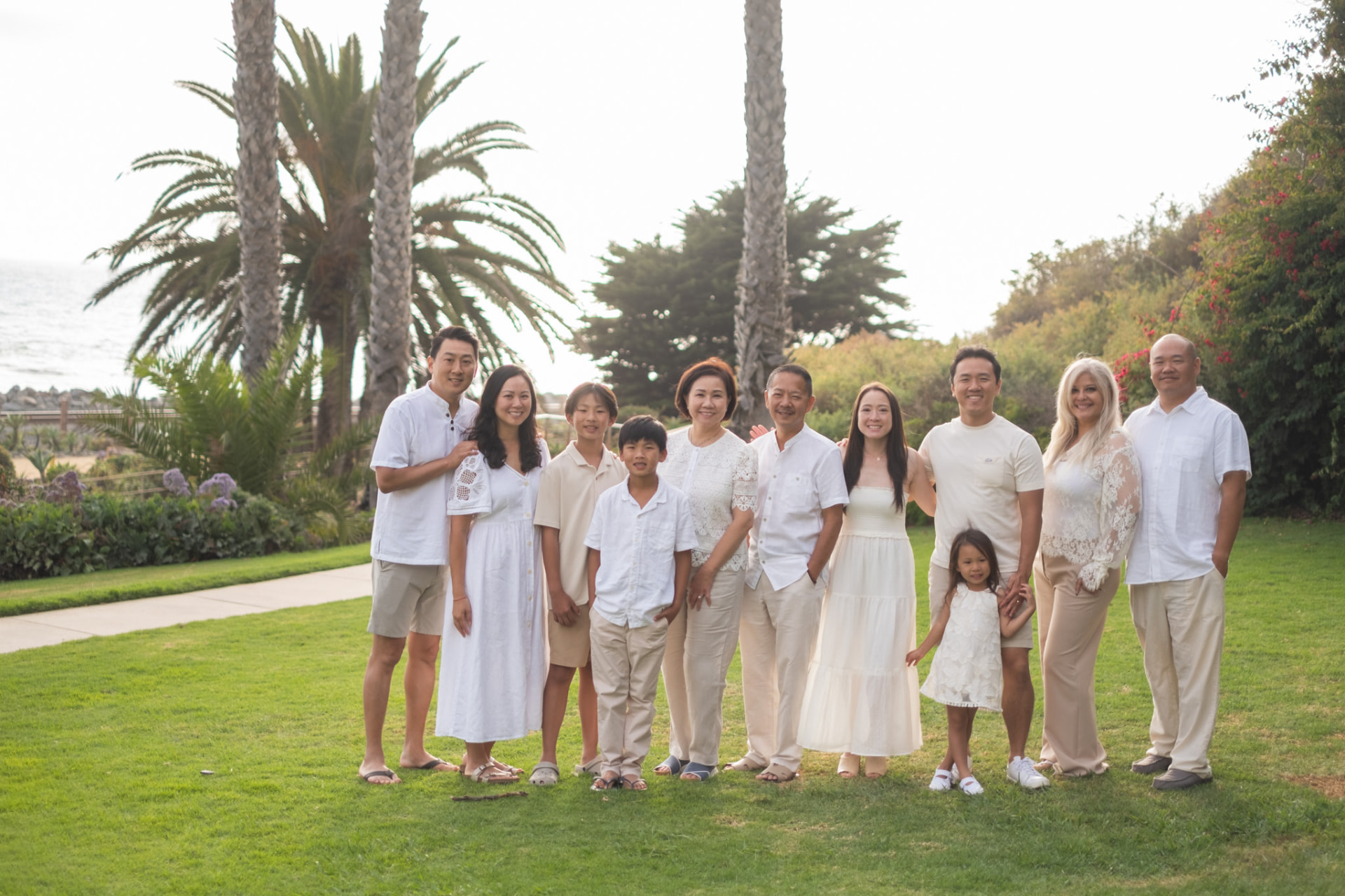 Large family portrait on the lawn above the ocean