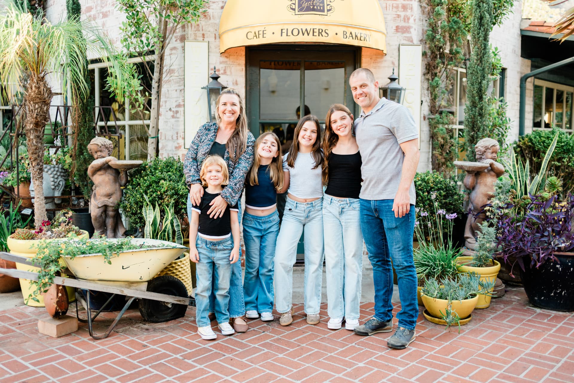 Family of six outside a garden cafe in Palos Verdes